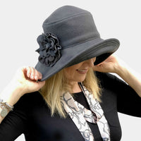 Wide brim Eleanor cloche in gray wool with fabric flower brooch handmade Boston Millinery