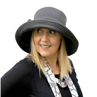 Wide brim Eleanor cloche in gray wool with fabric flower brooch handmade Boston Millinery