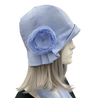 Polly cloche hat in blue linen with periwinkle chiffon rose and scarf  side view of pleating and rose
