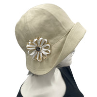 1920s style Polly wide front brim beige ,linen cloche hat with ribbon flower and button brooch side view