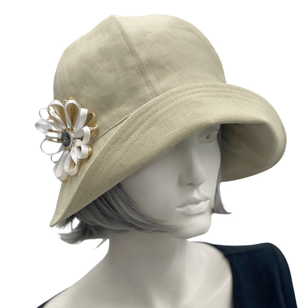 Polly wide front brim beige ,linen cloche hat with ribbon flower and button brooch 