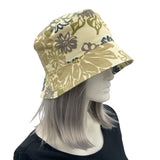 Leaf Print bucket hat shown modeled on hat mannequin handmade by Boston Millinery