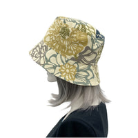 Leaf Print bucket hat shown modeled on hat mannequin handmade by Boston Millinery side view