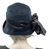 1920s Style black velvet cloche hat with satin bow scarf modeled on a mannequin rear view Handmade by Boston Millinery 