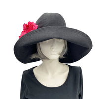 Wide Brim Derby Hat with deep pink flower brooch front view
