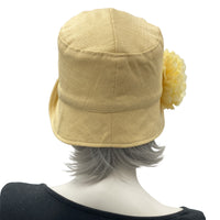 Yellow Gold Eleanor Linen Cloche Hat with narrow brim and flower with rhinestone brooch rear view
