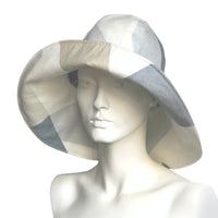 Womens wide brim derby hat in neutral and blue patchwork linen side view