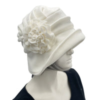 Boston Millinery's handmade winter white cream fleece 1920s style cloche hat for women, shown here on a hat mannequin. Side view of hat 