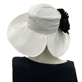 White Linen derby hat for women rear view of open brim-  modeled on a hat mannequin Boston Millinery USA