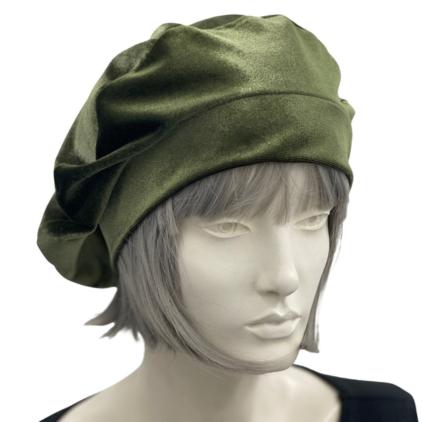 Sage green velvet beret shown modeled on a hat mannequin side front view handmade by Boston Milliner