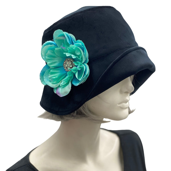 1920s Cloche Hat, Winter Hat Women, Black Velvet Hat with Turquoise and Rhinestone Peony Flower Brooch, Handmade in USA.Side view of flower view modeled on a hat mannequin head