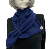 Matching fleece scarf in navy blue shown on a mannequin 