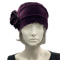 Velvet Cloche Hat and Chemo Headwear in Eggplant with Satin Flower Embellishment modeled on a hat mannequin front view 