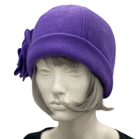 1930s Cloche Hat for Women modeled on a hat mannequin. Handmade in warm Fleece Hat. Purple with Large Flower Brooch, Satin Lined Winter Hat, Handmade in USA Boston Millinery. Side front view 