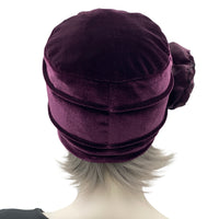 Velvet Cloche Hat and Chemo Headwear in Eggplant with Satin Flower Embellishment modeled on a hat mannequin rear view 