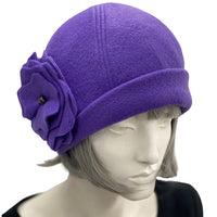 1930s Cloche Hat for Women modeled on a hat mannequin. Handmade in warm Fleece Hat. Purple with Large Flower Brooch, Satin Lined Winter Hat, Handmade in USA Boston Millinery. Top front view 