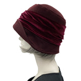 Cloche Hat the Eleanor narrow front brim dark burgundy eggplant wool with velvet band and square bow handmade by Boston Millinery  modeled on a hat stand side view 