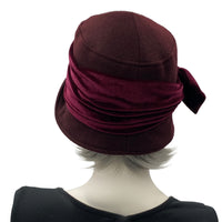Cloche Hat the Eleanor narrow front brim dark burgundy eggplant wool with velvet band and square bow handmade by Boston Millinery  modeled on a hat stand rear view 