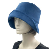 1920s Cloche Hat, Blue Velvet Hat with Hydrangea Flower Brooch, Handmade in the USA, Elegant Formal Headwear. modeled on hat mannequin, plain side view 