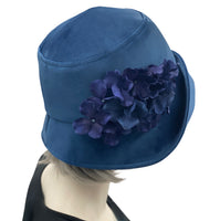 1920s Cloche Hat, Blue Velvet Hat with Hydrangea Flower Brooch, Handmade in the USA, Elegant Formal Headwearmodeled on hat mannequin, side view 