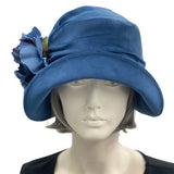 1920s Cloche Hat, Blue velvet with peony brooch modeled on a hat mannequin front view 