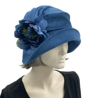 1920s Cloche Hat, Blue velvet with peony brooch modeled on a hat mannequin side view 