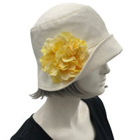 Boston Millinery's handmade Eleanor narrow brim cream linen cloche hat with spring green hydrangea brooch 