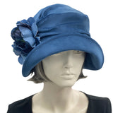 1920s Cloche Hat, Blue velvet with peony brooch modeled on a hat mannequin front view 